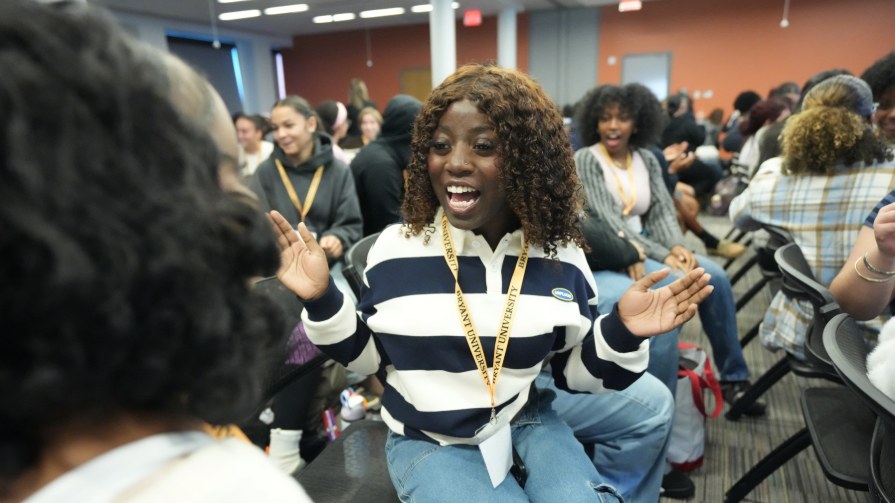 A high school student engages in an icebreaker game at BryantUniversity's Belonging Institute.